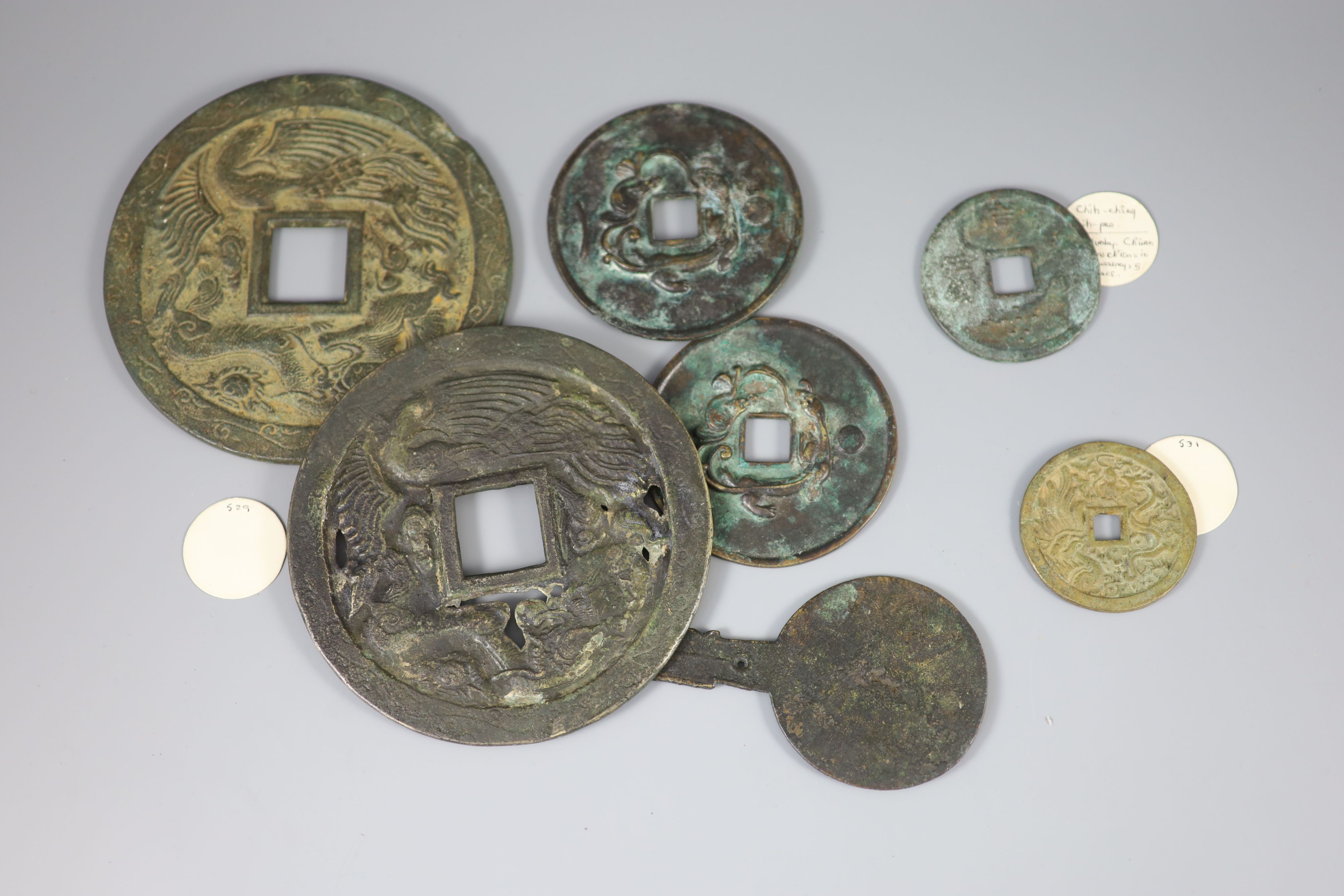 A group of 7 Chinese bronze coin charms or amulets, Qing dynasty- Republic period,